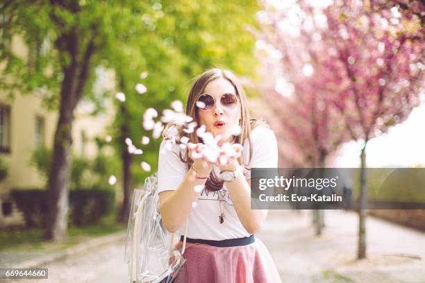 spring portrait of a beautiful woman - one petal cherry blossom stock pictures, royalty-free photos & images
