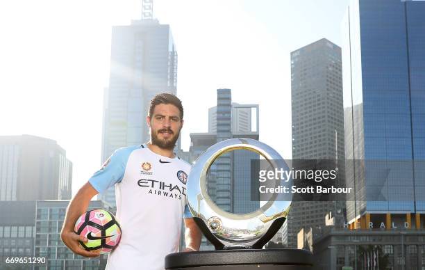 Melbourne City FC Captain Bruno Fornaroli poses with the Hyundai A-League Championship Trophy during an A-League Melbourne media opportunity at...