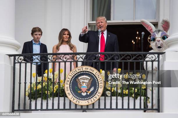 President Donald Trump with first lady Melania Trump and their son Barron Trump speaks from the Truman Balcony during the 139th Easter Egg Roll on...