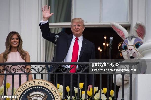 President Donald Trump with first lady Melania Trump speaks from the Truman Balcony during the 139th Easter Egg Roll on the South Lawn of the White...