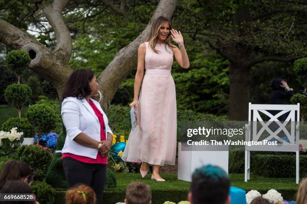 First lady Melania Trump walks out to read to children during the 139th Easter Egg Roll on the South Lawn of the White House in Washington, DC on...