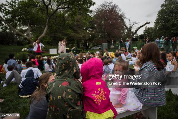 Girl cries as first lady Melania Trump reads to children during the 139th Easter Egg Roll on the South Lawn of the White House in Washington, DC on...