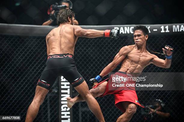 Ramon Gonzales throws a kick at the leg of Yodsanan Sityodtong during the ONE Championship: Warrior Kingdom event at the Impact Arena on March 11,...