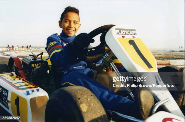 British Junior Go Kart racer, Lewis Hamilton, aged 10, ready for a drive at Kimbolton race track in England, 19th December 1995.