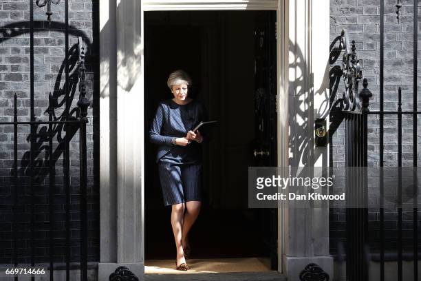 Prime Minister Theresa May prepares to make a statement to the nation in Downing Street on April 18, 2017 in London, United Kingdom. The Prime...