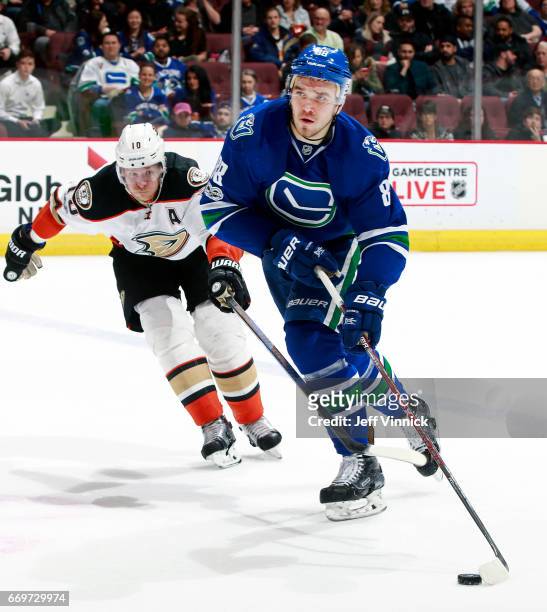 Corey Perry of the Anaheim Ducks checks Nikita Tryamkin of the Vancouver Canucks during their NHL game at Rogers Arena March 28, 2017 in Vancouver,...