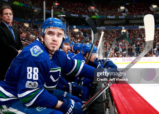 Nikita Tryamkin of the Vancouver Canucks looks on from the bench during their NHL game against the Anaheim Ducks at Rogers Arena March 28, 2017 in...