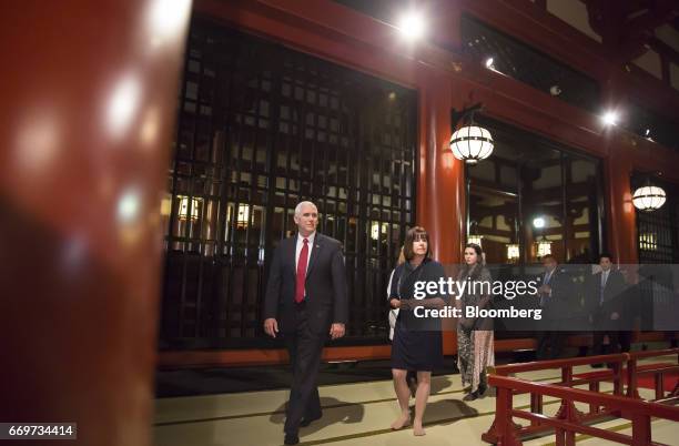 Vice President Mike Pence, left, second lady Karen Pence, center left, and one of their daughters Audrey, walk through the Sensoji temple in Tokyo,...