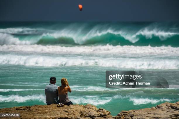 couple watching the waves near cape town, south africa - junges paar stock pictures, royalty-free photos & images