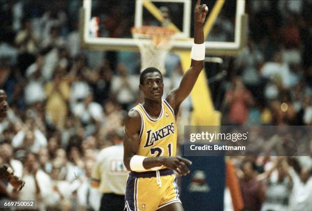 Laker forward Michael Cooper raises his finger to signify the Lakers are at the end of the game 6/4. Cooper threw in 6 three point baskets in 7 tries.