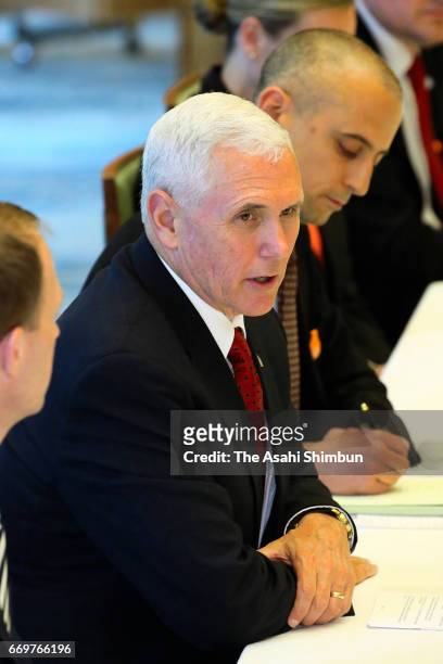 Vice President Mike Pence talks to Japanese Deputy Prime Minister and Finance Minister Taro Aso during their meeting at Prime Minister Shinzo Abe's...