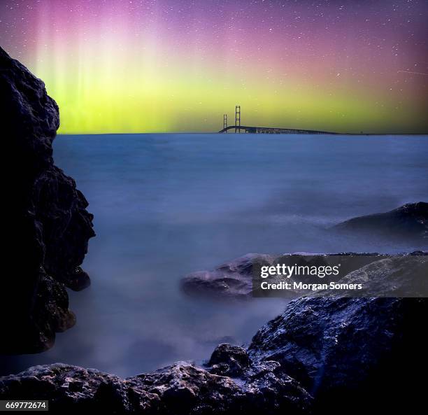 norther lights over the mighty mac - lake huron stock pictures, royalty-free photos & images
