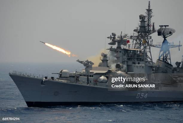 Rocket is fired from the Indian Navy destroyer ship INS Ranvir during an exercise drill in the Bay Of Bengal off the coast of Chennai on April 18,...