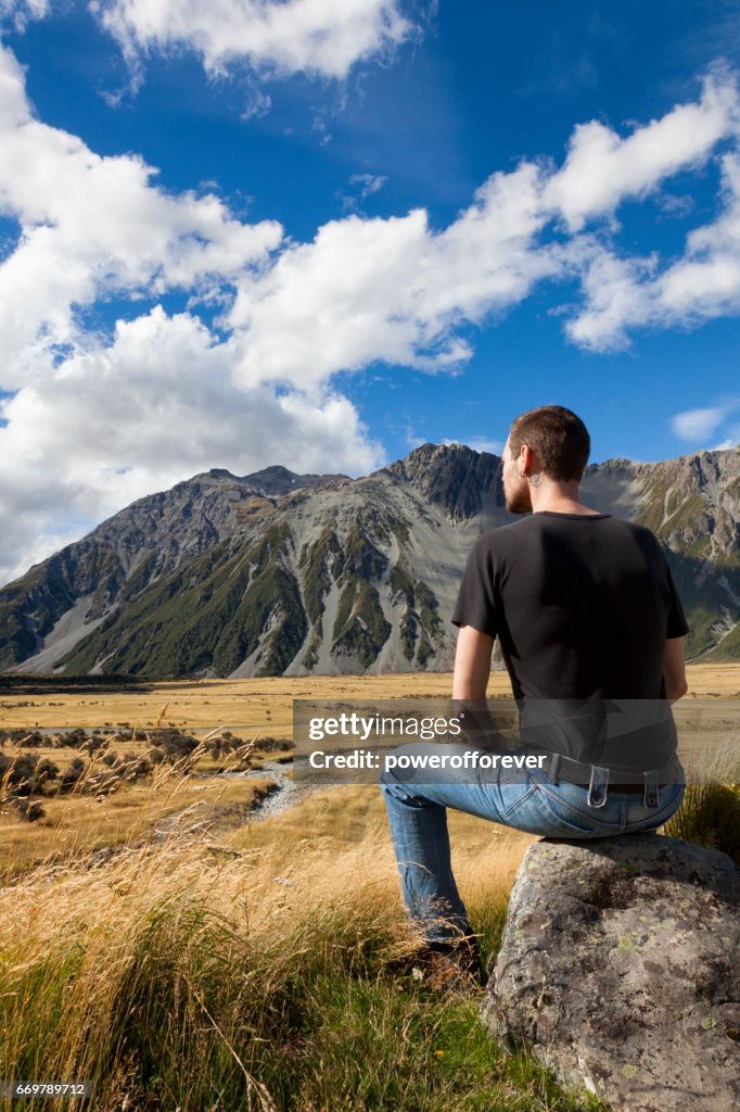 Tourist at Mount Cook of the Southern Alps in New Zealand
