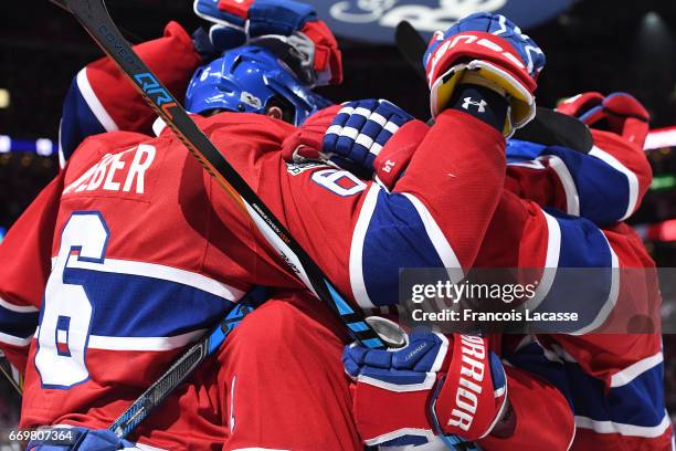 Paul Byron, Brendan Gallagher and Shea Weber of the Montreal Canadiens celebrate a goal against the New York Rangers in Game Two of the Eastern...