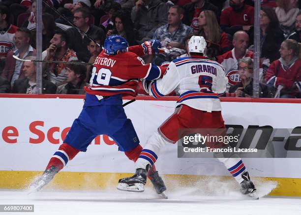 Nikita Nesterov of the Montreal Canadiens and Dan Girardi of the New York Rangers battle for position in Game Two of the Eastern Conference...