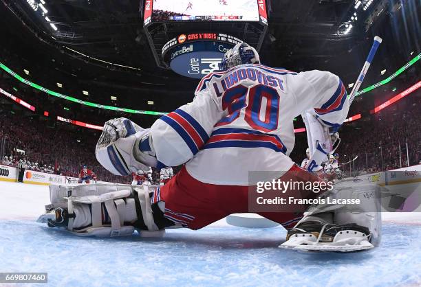 Henrik Lundqvist of the New York Rangers defends the goal against the Montreal Canadiens in Game Two of the Eastern Conference Quarterfinals during...
