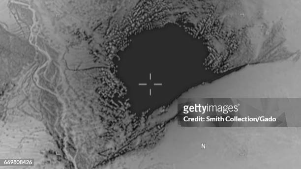 Still from aerial view of a GBU-43/B Massive Ordnance Air Blast bomb, colloquially known as the Mother of All Bombs, striking an ISIS-K cave and...