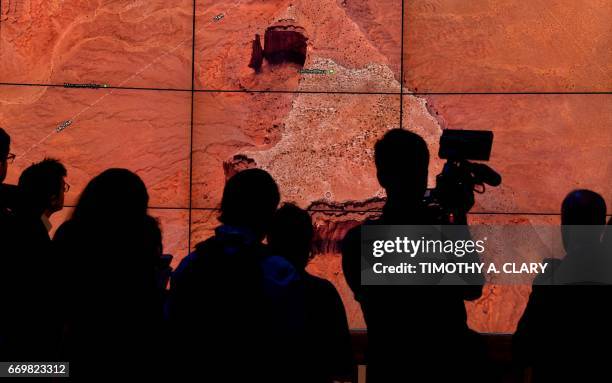 Person looks at a Google Earth map of Sentinel Mesa, Monument Valley National Park, Utah-Arizona, United States on a screen as Google Earth unveils...