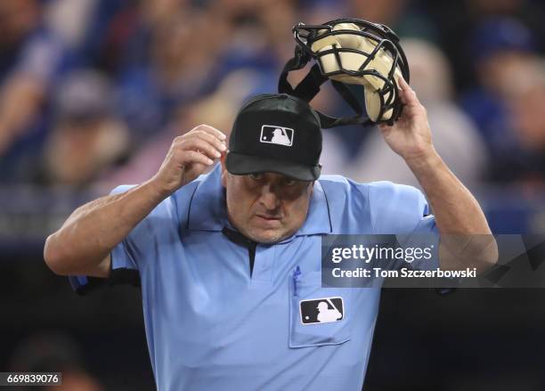 Home plate umpire Dale Scott during the Toronto Blue Jays MLB game against the Baltimore Orioles at Rogers Centre on April 14, 2017 in Toronto,...