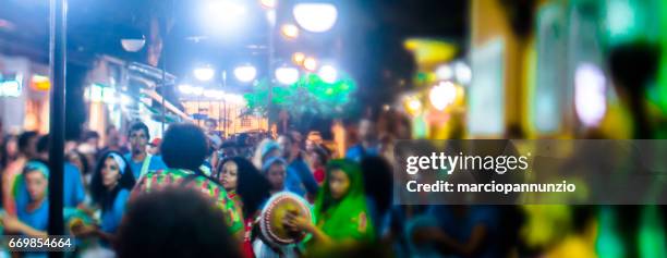 courtship of maracatu - traditional folk dance with african roots - with the batuki kianda group in ilhabela, brazil, on april 16, 2017, walking the streets of the historic city center. photos made with a tilt-shift lens. - africano stock pictures, royalty-free photos & images