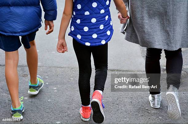 mother and children walks down the street together - photohui stock pictures, royalty-free photos & images