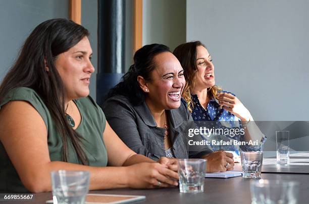 women laugh during a business meeting - photohui stock pictures, royalty-free photos & images
