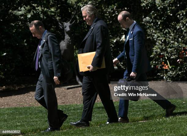 White House Chief of Staff Reince Priebus , chief political strategist Steve Bannon , and senior policital advisor Stephen Miller walk to a waiting...