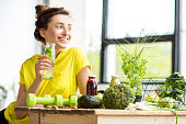 Woman with healthy food indoors