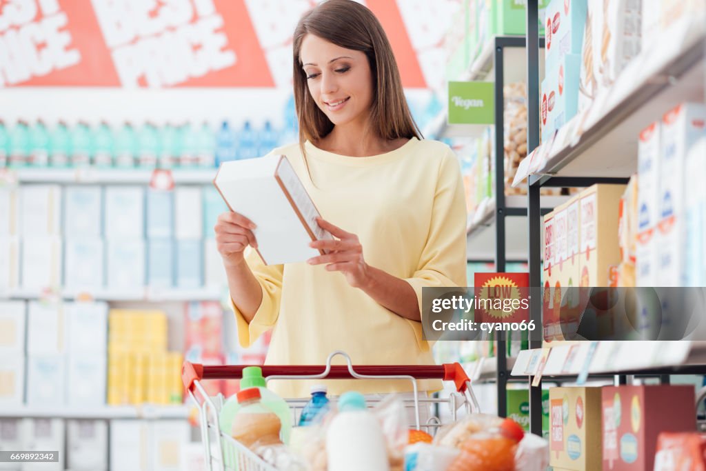 Woman reading food labels