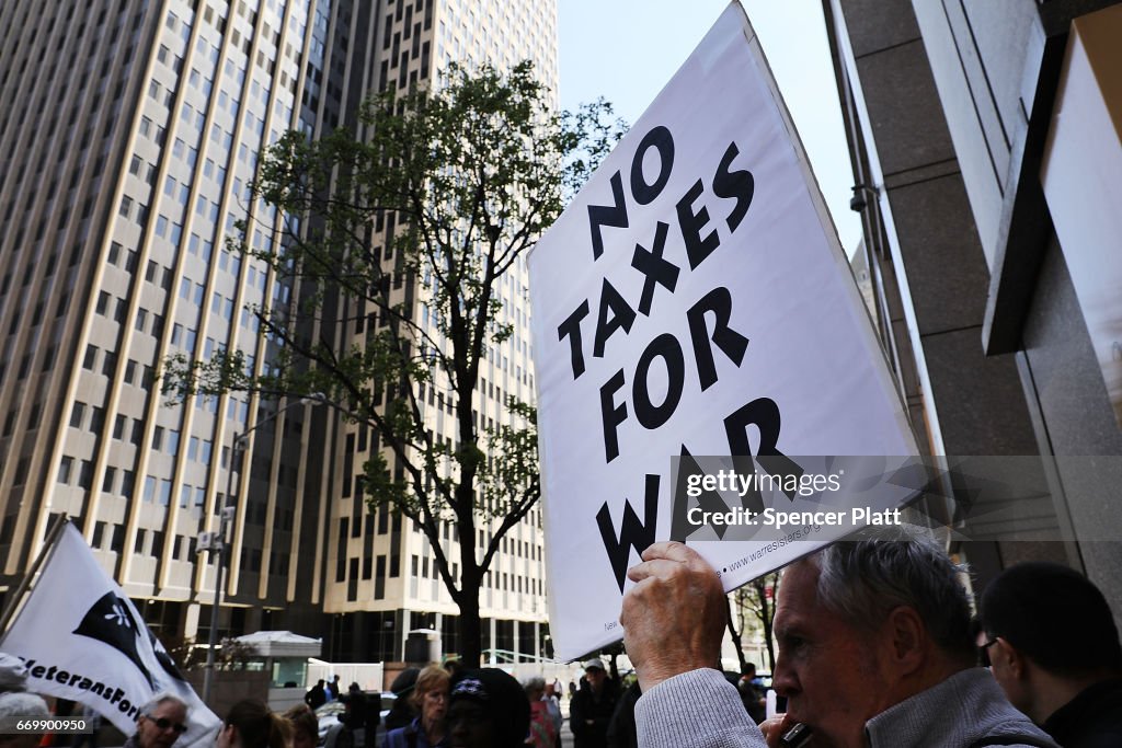 Activists Protest Tax Dollars Being Spent On U.S. Wars At NYC IRS Building