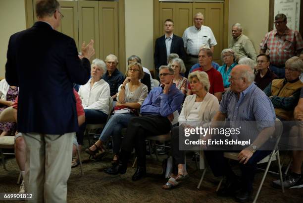 Constituents listen as U.S. Rep. Mike Conaway holds a town hall meeting at the Mason County Library on April 18, 2017 in Mason, Texas. Conaway is...