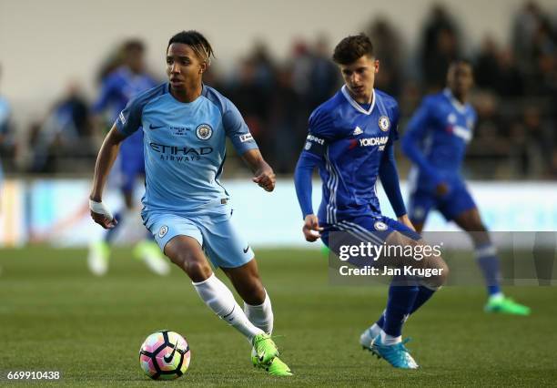 Demeaco Duhaney of Manchester City is put under pressure from Mason Mount of Chelsea during the FA Youth Cup Final First Leg match between Manchester...