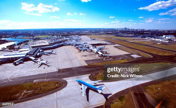 An airplane taxis off the runway in this aerial August 22, 2000 at the Charles Kingsford-Smith airport in Sydney, Australia. Major failures in the...