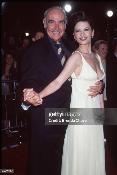 Actors Sean Connery and Catherine Zeta-Jones attend the premiere of their new movie "Entrapment" April 15, 1999 in Hollywood, CA. It has been...
