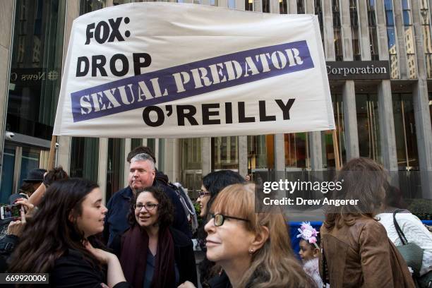 Demonstrators rally against Fox News television personality Bill O'Reilly outside of the News Corp. And Fox News headquarters in Midtown Manhattan,...