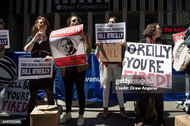 Demonstrators rally against Fox News television personality Bill O'Reilly outside of the News Corp. And Fox News headquarters in Midtown Manhattan,...