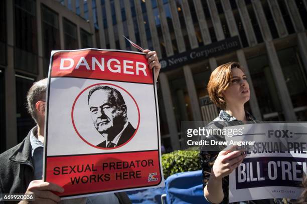 Demonstrators rally against Fox News television personality Bill O'Reilly outside of the News Corp. And Fox News headquarters in Midtown Manhattan,...