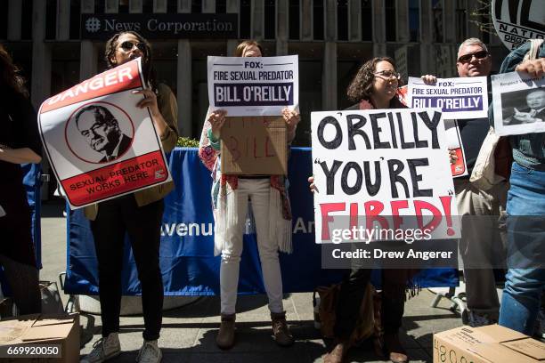 Demonstrators rally against Fox News television personality Bill O'Reilly outside of the News Corp. And Fox News headquarters in Midtown Manhattan,...