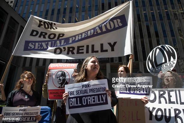 Demonstrators rally against Fox News television personality Bill O'Reilly outside of the News Corp. And Fox News headquarters in Midtown Manhattan,...