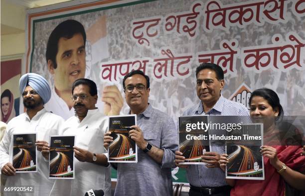Delhi Pradesh Congress Committee President Ajay Maken with other leaders releases the Delhi Congress manifesto on Urban Infrastructure, fifth in the...