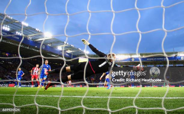 Saul Niguez of Atletico Madrid scores his sides first goal past Kasper Schmeichel of Leicester City during the UEFA Champions League Quarter Final...