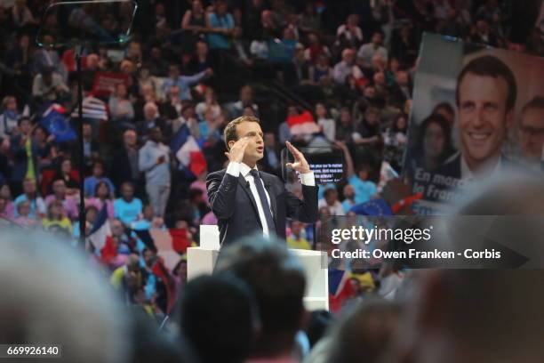 French presidential candidate Emmanuel Macron delivers a speech during a campaign rally at AccorHotels Arena on April 17, 2017 in Paris, France....