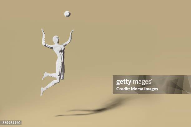 hand geschnitten papier figur des volleyball-spieler - human representation stock-fotos und bilder