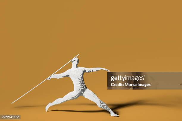 Hand cut paper figure of a javelin thrower