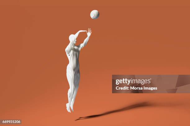 Hand cut paper figure of baketball player