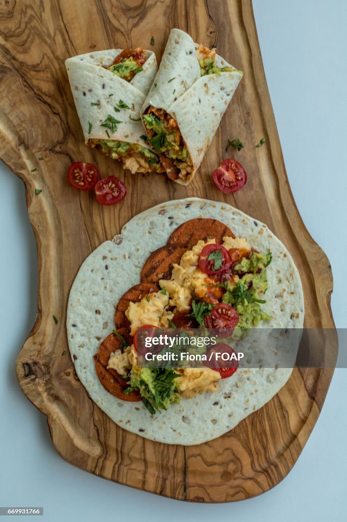 Breakfast burritos with scrambled eggs and pepperoni