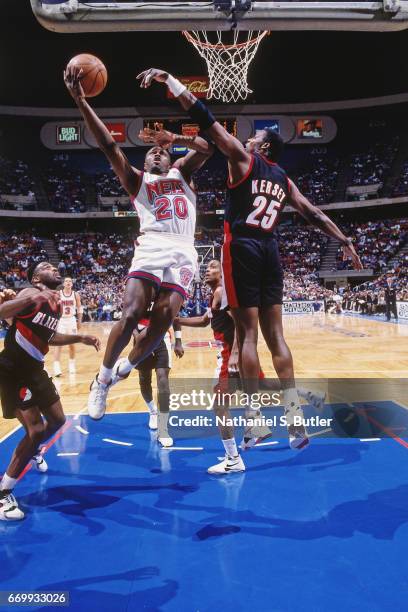 Rumeal Robinson of the New Jersey Nets shoots against the Portland Trail Blazers during a game played circa 1993 at the Brendan Byrne Arena in East...