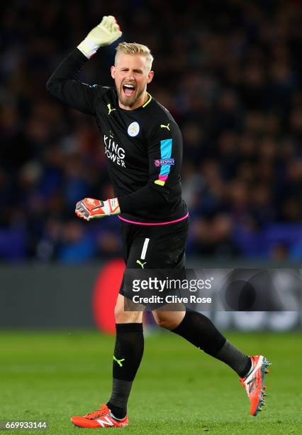 Kasper Schmeichel of Leicester City celebrates after Jamie Vardy of Leicester City scored Leicester City's first goal during the UEFA Champions...