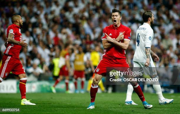 Bayern Munich's Polish forward Robert Lewandowski celebrates a goal during the UEFA Champions League quarter-final second leg football match Real...